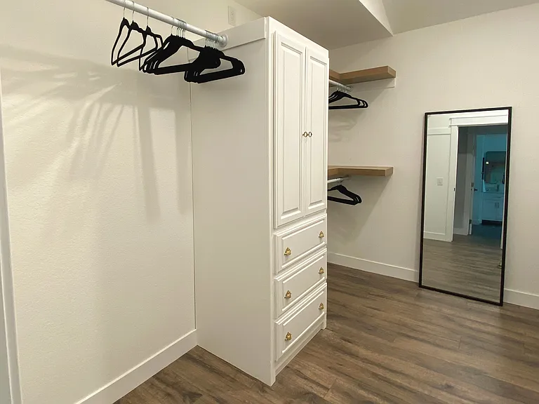 Enjoy the convenience of a spacious master walk-in closet_perfect for unpacking, organizing, and feeling right at home during your stay. Plenty of room for all your essentials and more.
