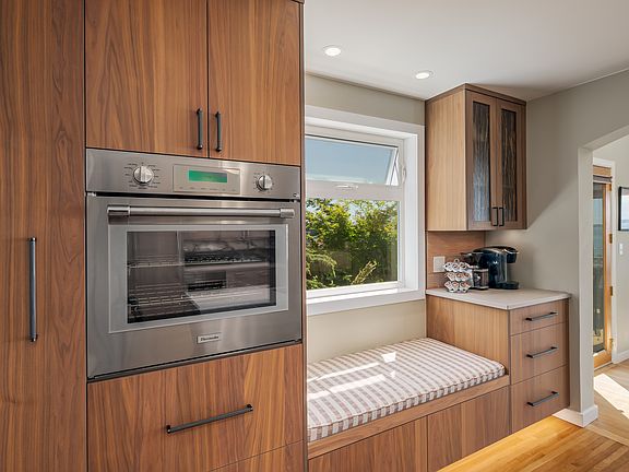 Built-in oven and tall slide-out spice cabinet.