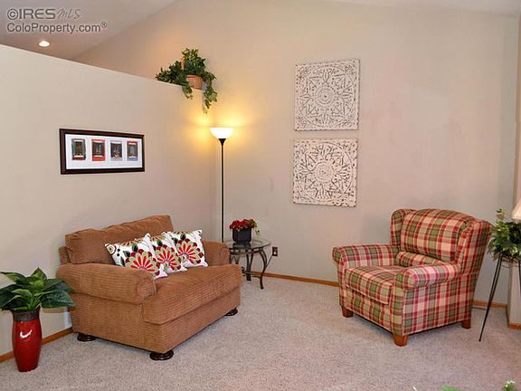 Living room open with vaulted ceiling.