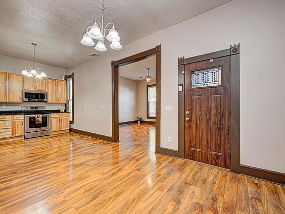 Spacious dining room with high end flooring.
