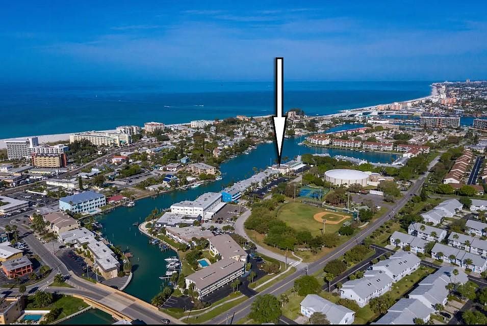 On a canal and a short walk or drive to the beautiful and wide beach.