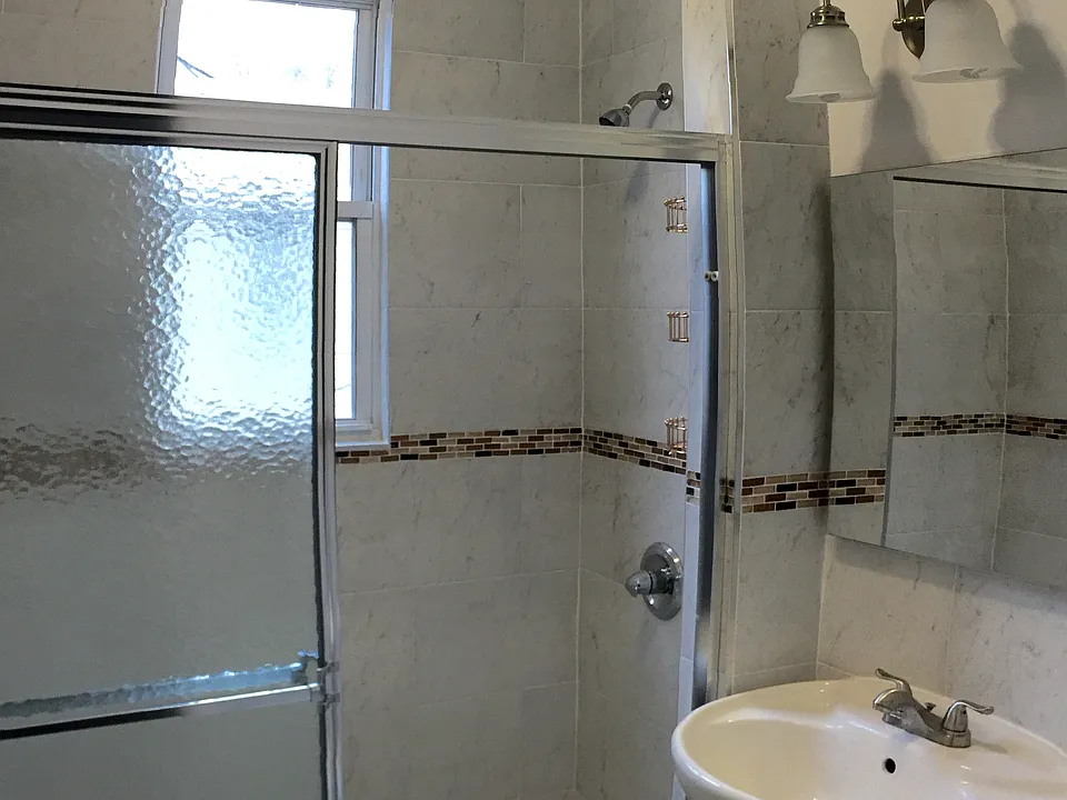 All NEW modern standing shower with glass sliding doors