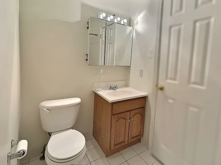 Hall bathroom with full tub