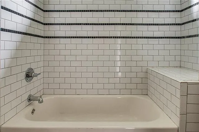 Custom tiled tub/shower in Primary bathroom along with a dual sink vanity
