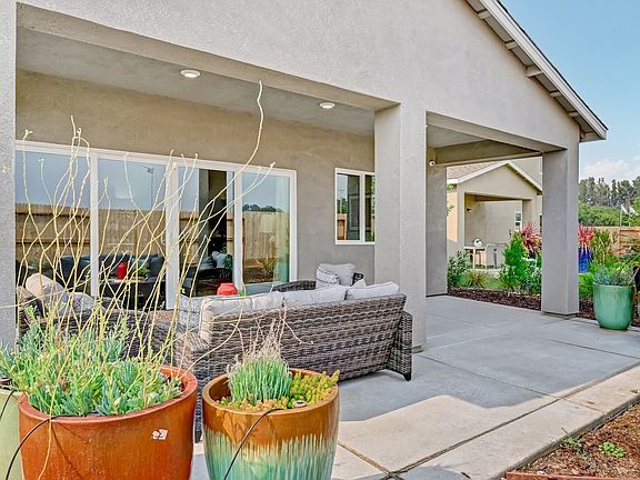 Patio with spacious backyard