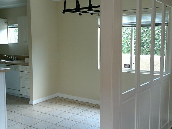 Area inside front door and next to kitchen