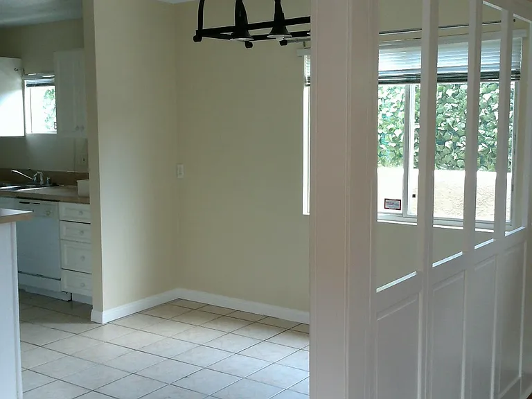 Area inside front door and next to kitchen