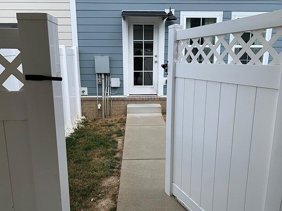Fenced Backyard off of Covered Parking area in Rear of Townhome!
