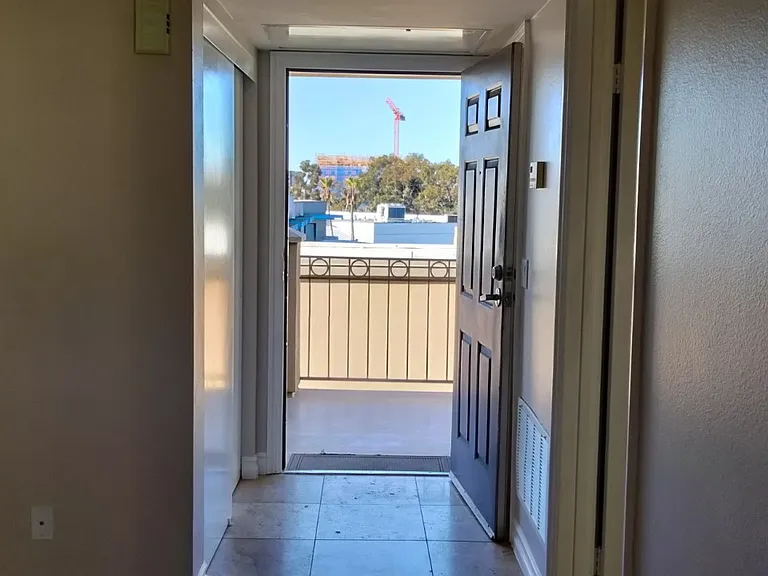 West entry door with closet on left.