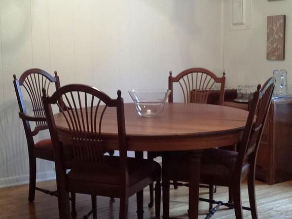 Big, antique wood kitchen table and chairs