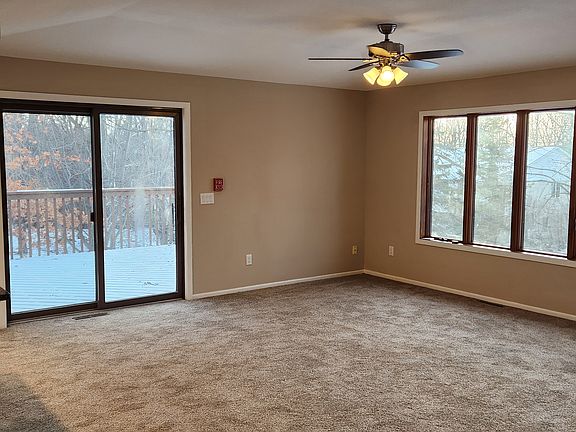 View of kitchen, patio door, and DR.