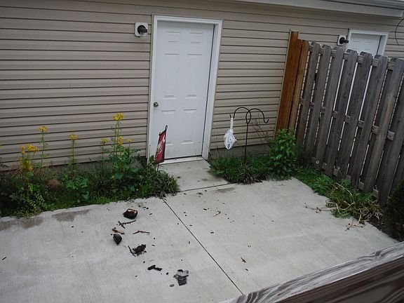 Back patio with access to 2-car garage.