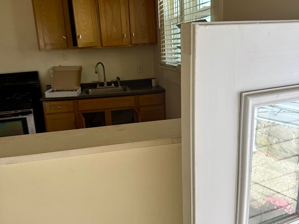 There's a short "pony" wall between the side entry hallway and the kitchen.