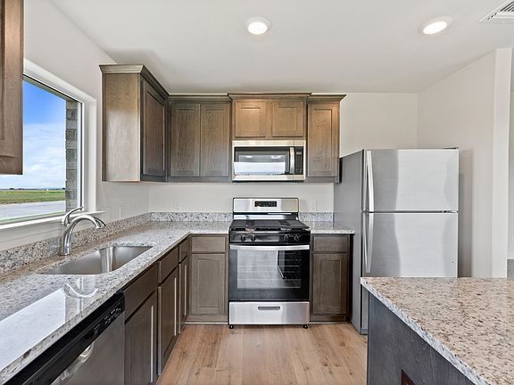 The kitchen has energy efficient appliances.