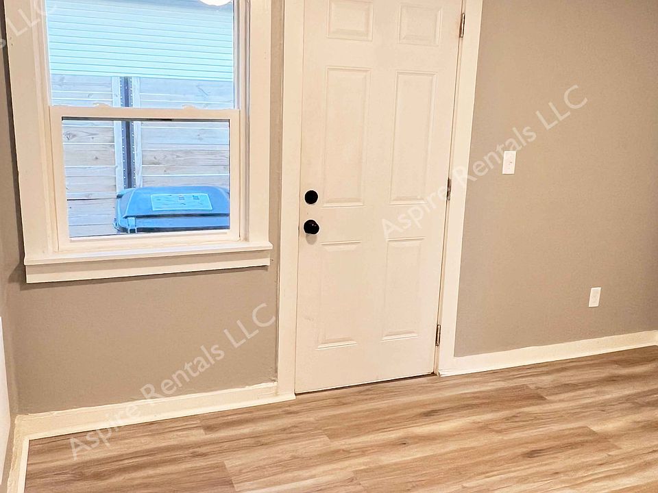 Looking at the front door from the kitchen.