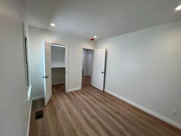 Bedroom 1 with Walk-in closet view.