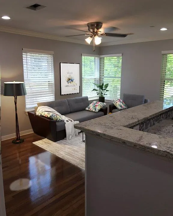 Light and Bright Living Room with recessed can lighting and ceiling fan
