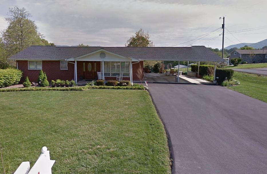 Front view of house with large 2 car carport