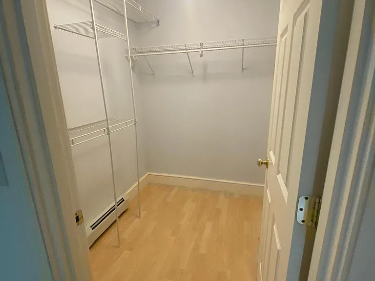 Walk-in closet off bedroom.