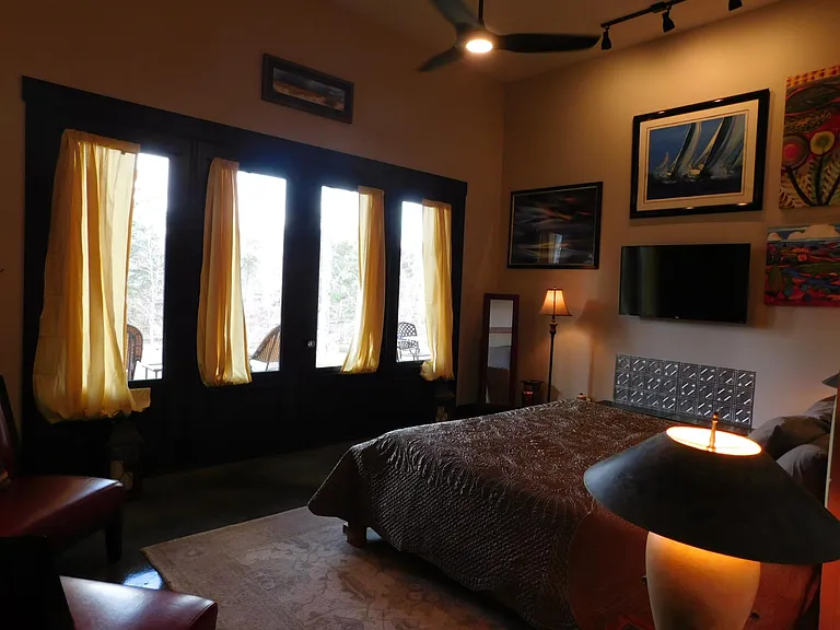 French doors off of Master bedroom open on to an expansive porch