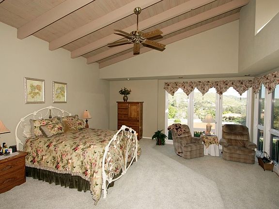 Master bedroom with vaulted ceilings, walk-in closet and private bath
