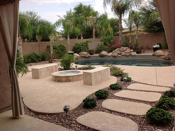 Backyard with fire pit and pool
