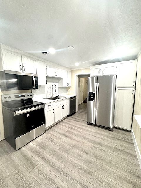 Quartz countertop, brand new appliances, new flooring