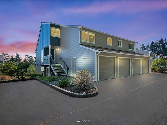 Desirable end-unit with attached garage + 1 parking space.