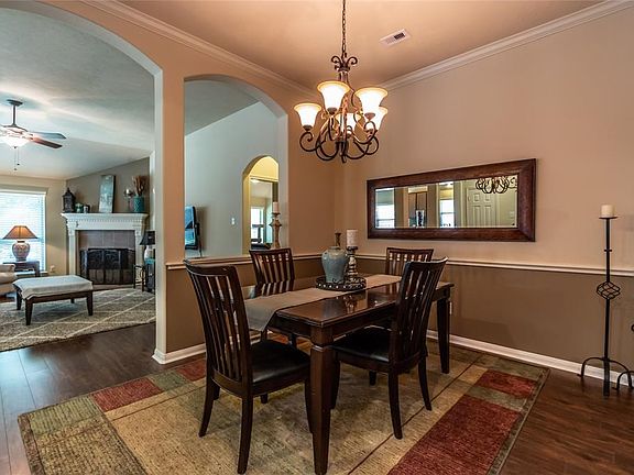 Elegant formal dining room opens to kitchen and living
