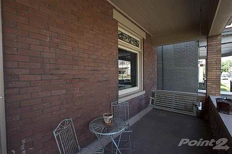 Read a good book from the comforts of this covered front porch