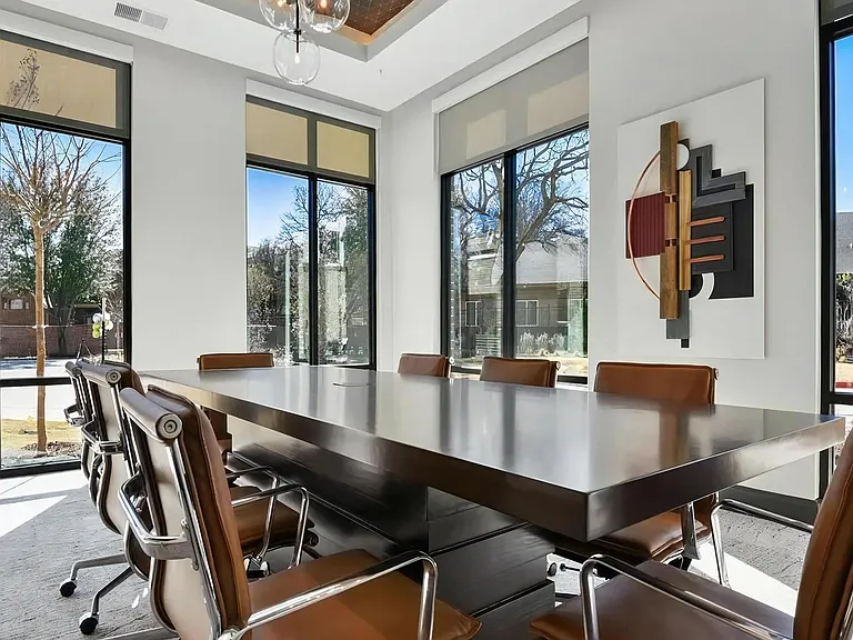 Modern Conference Space with Leather Chairs and Wall Art