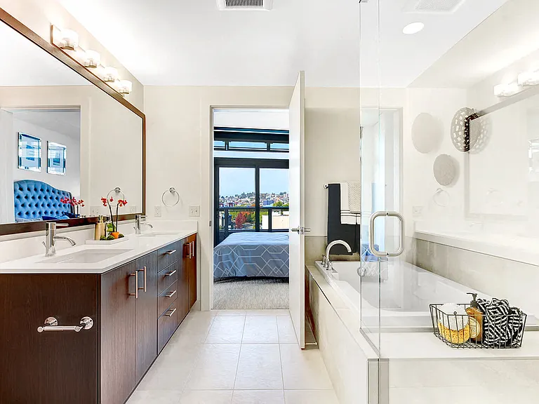 Spa-inspired bathrooms with glass shower doors and separate soaking tubs