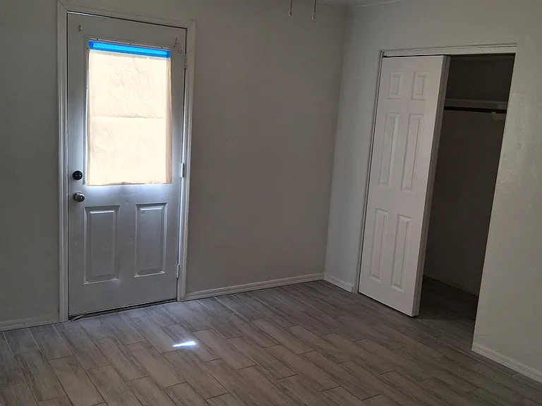 Master bedroom on floor level with full ensuite bathroom and side exit door