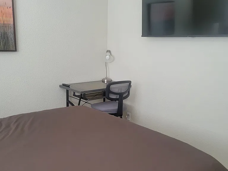 Desk and 55-in. tv with streaming service in 2nd bedroom.