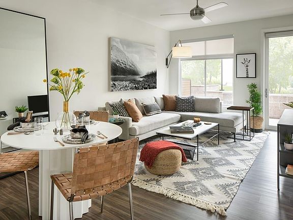 Spacious living room with wood-style flooring and large windows
