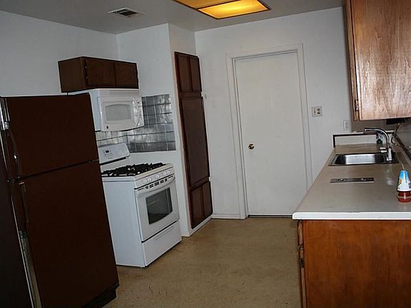Check out this kitchen with brand new appliances, spacious pantry & storage cabinets.