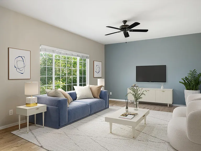Family Room is adjacent to the kitchen (virtually staged)