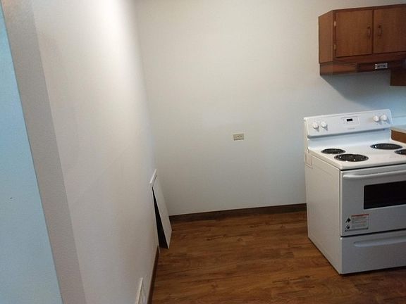 Kitchen with seating area, fridge, new paint and floor!