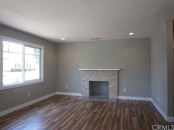 Updated fireplace, recessed lighting on dimmers, new flooring, double pane windows