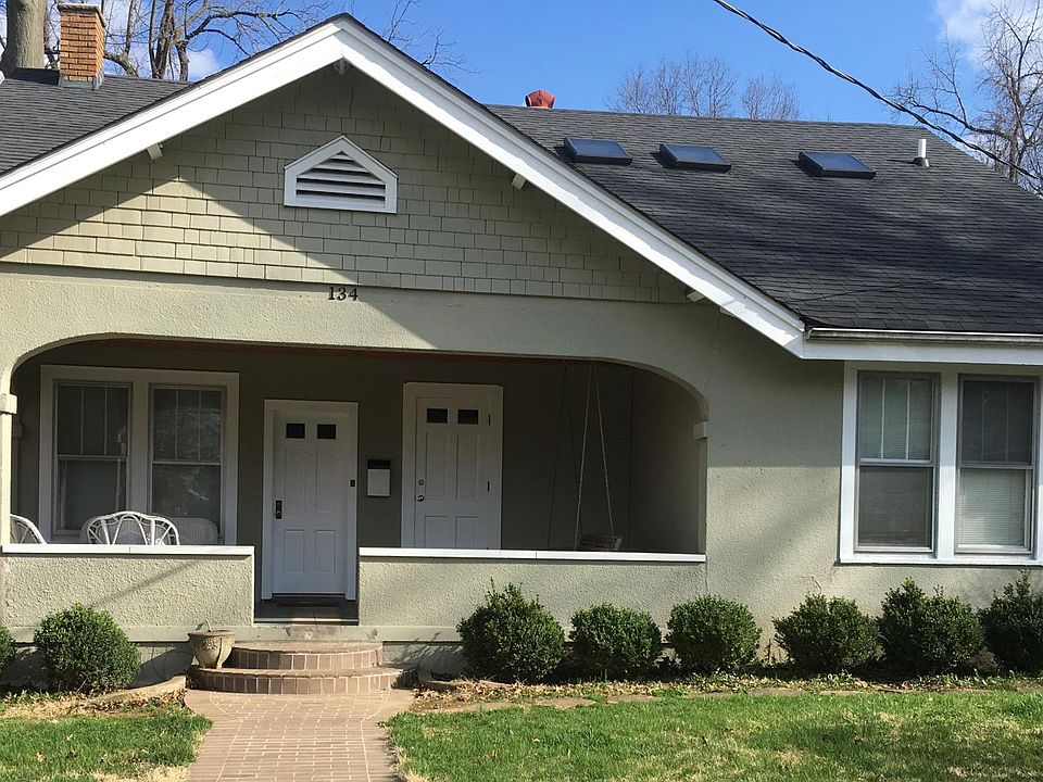 Renovated Bungalow with Wicker Chairs and Porch Swing