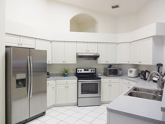 Open kitchen with new stainless steel appliance