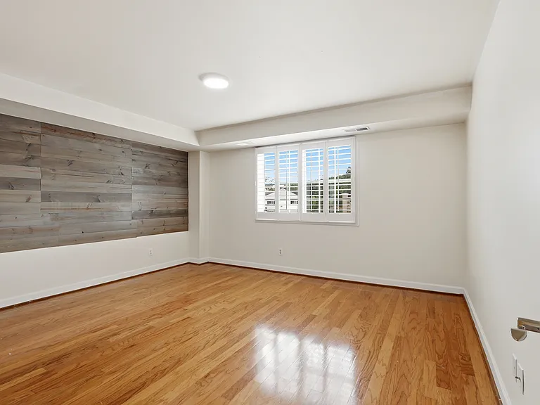 Large bedroom with accent wall