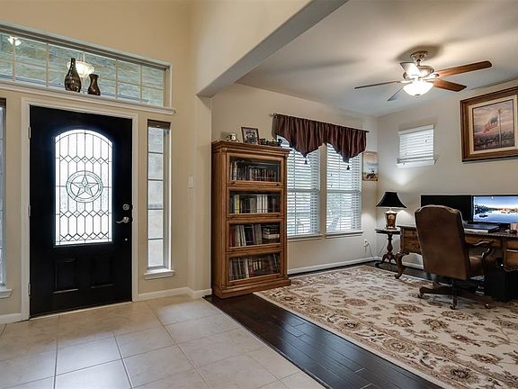 18 inch tile welcomes you as you enter the home, to the left is the study.