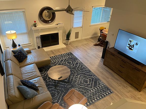 Living room furnished with wood burning fireplace. Available unfurnished as well!