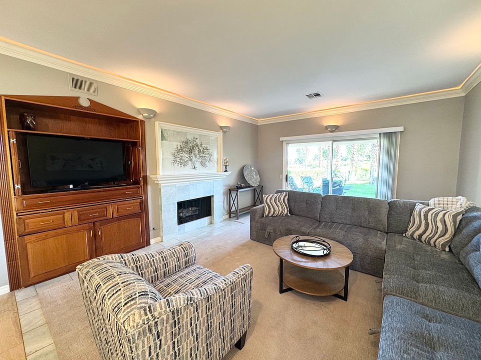 Media center, gas fireplace and walk out to patio!