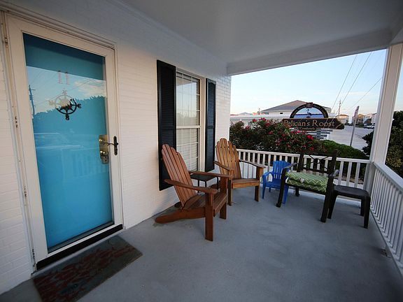 Wide front porch to catch the ocean breeze. Perfect for coffee in the mornings and drinks in the evenings.