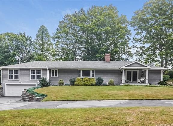 Sprawling pristine ranch. Vinyl cedar impression siding. 4 garages. 2 attached and 2 under.