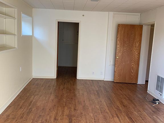 Large studio for bedroom and living room (door at back of room leads to walk in closet/office space)