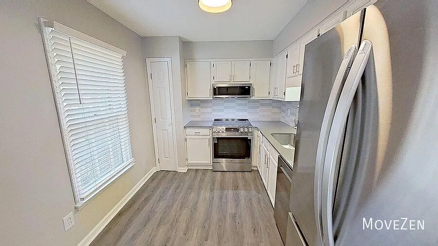 1313 Dylan Heath Ct Raleigh, NC 27608 Fenced Patio with Outside Storage, End Unit — Photo 4