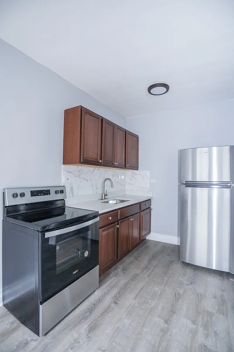 Building Photo - 6950 N Ashland Blvd #310